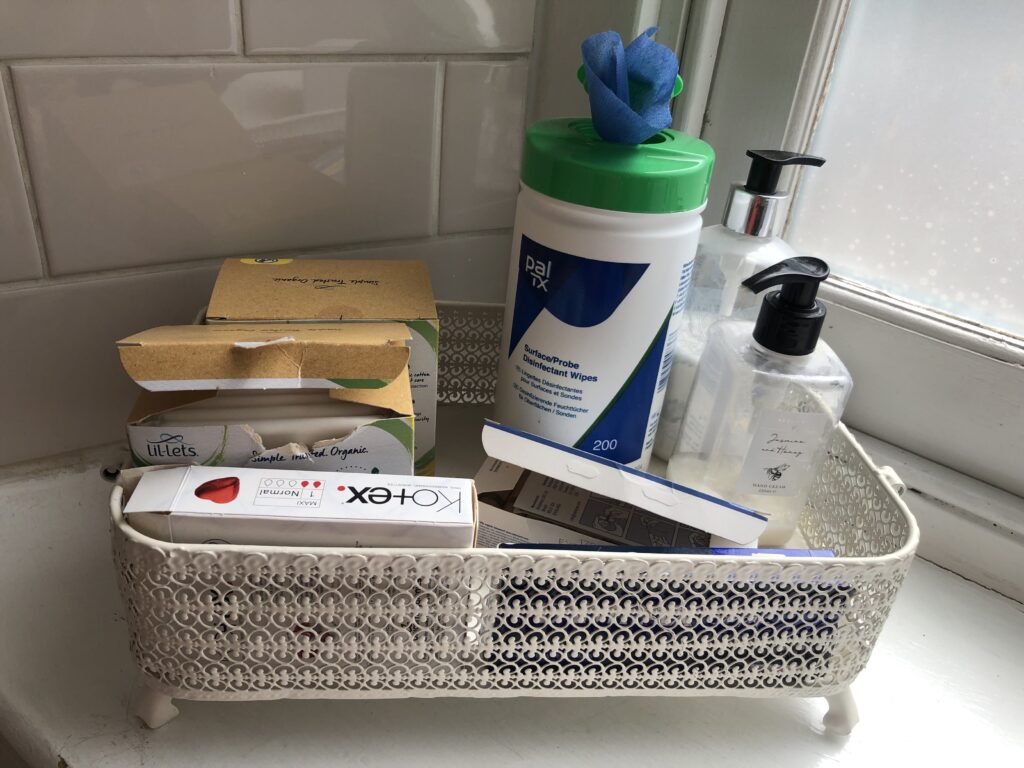 Selection of period products on a bathroom window sill.